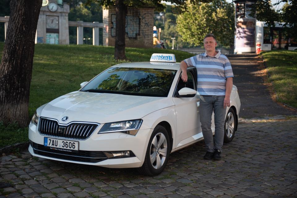 Car with a person standing